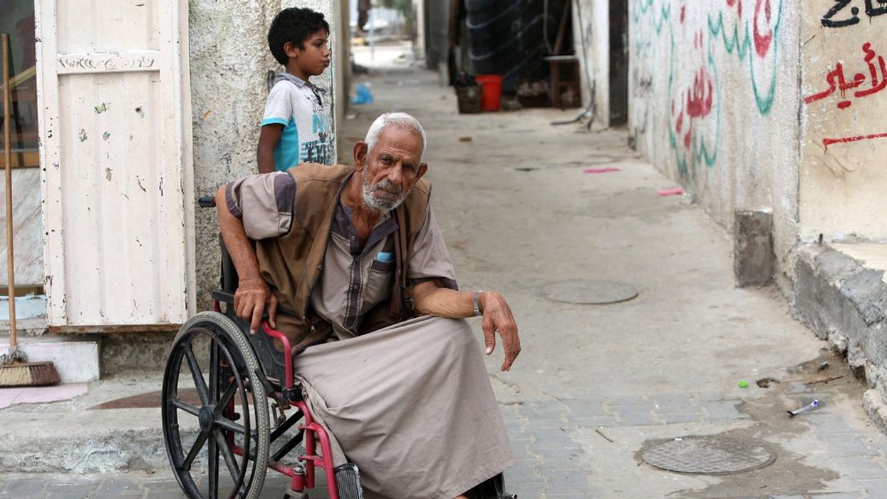 A Palestinian with disability sits in a wheelchair
