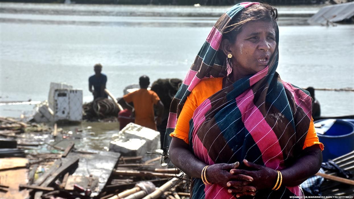 A woman in Bangladesh mourns damage done by cyclone.