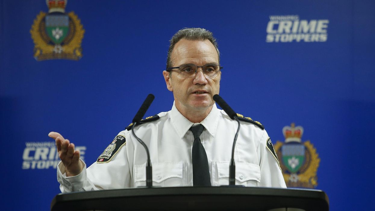 Chief Danny Smyth stands at podium and provides case update