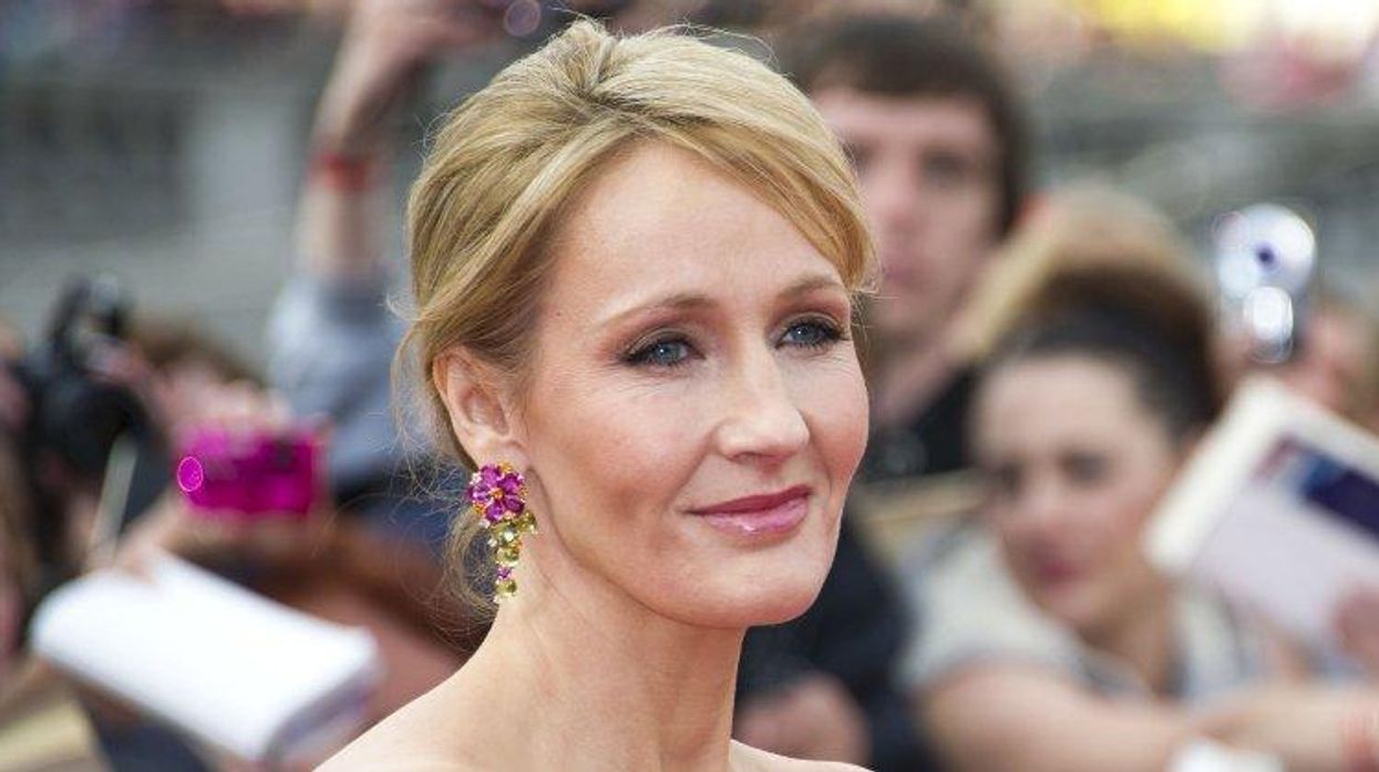 JK Rowling poses on a carpet