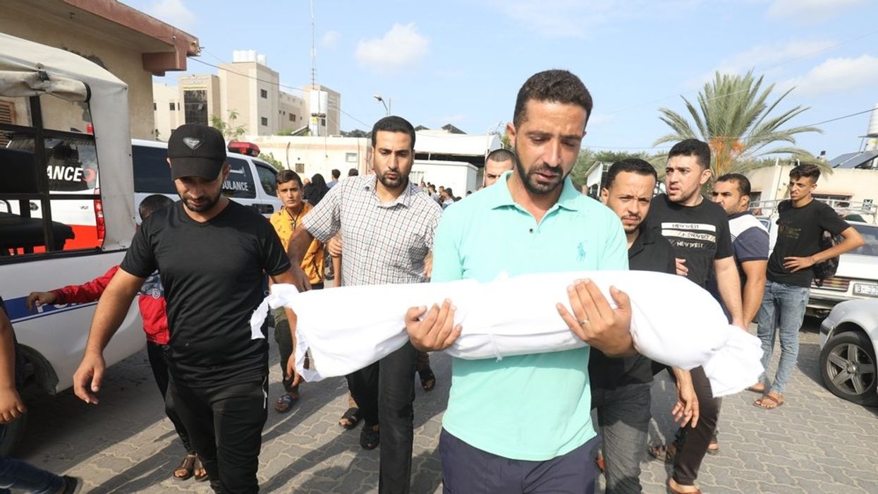 Palestinians carry the body of a 3-year-old child