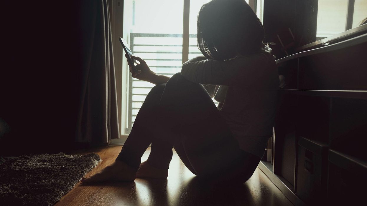 Phone in dark room stock