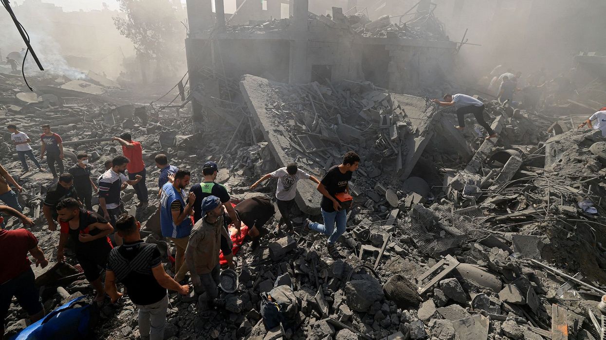Search for survivors and bodies in the rubble of buildings destroyed during Israeli bombardments
