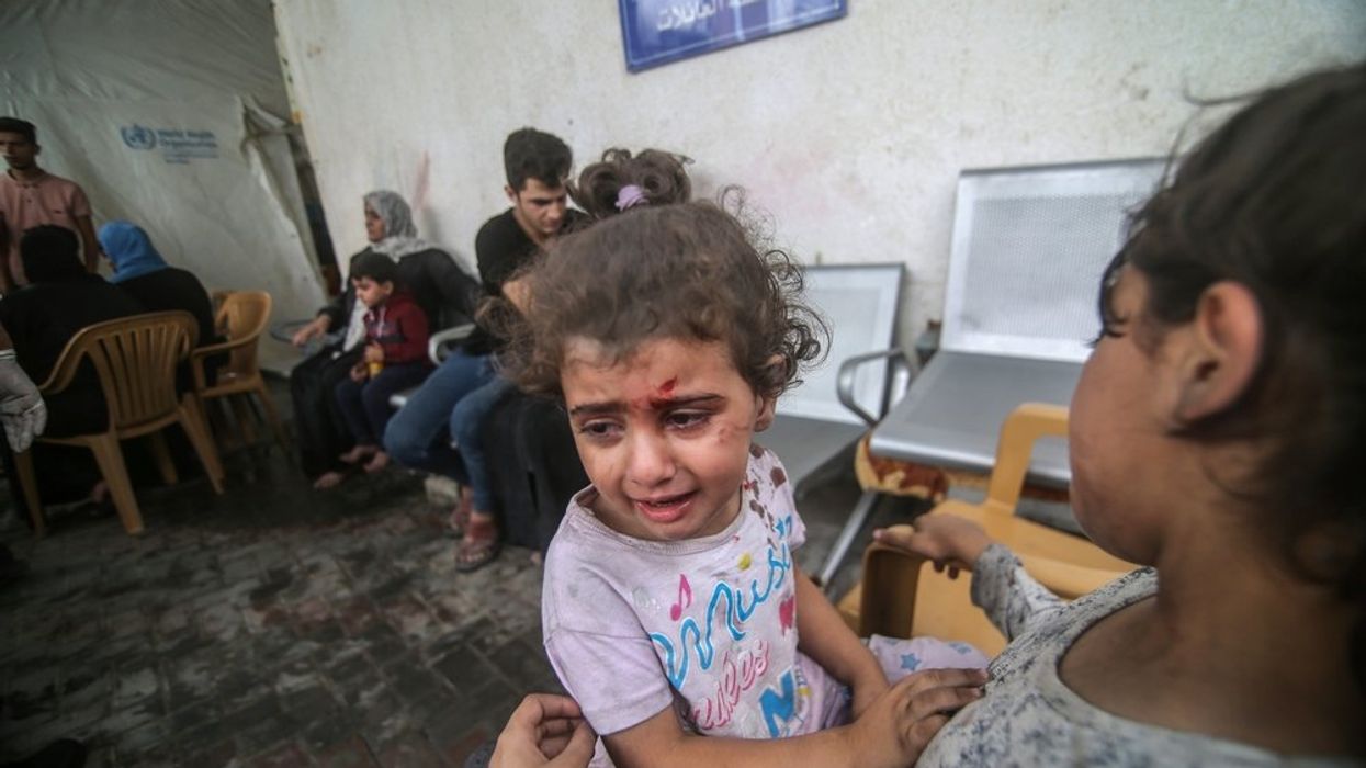 Young wounded Palestinian girl crying